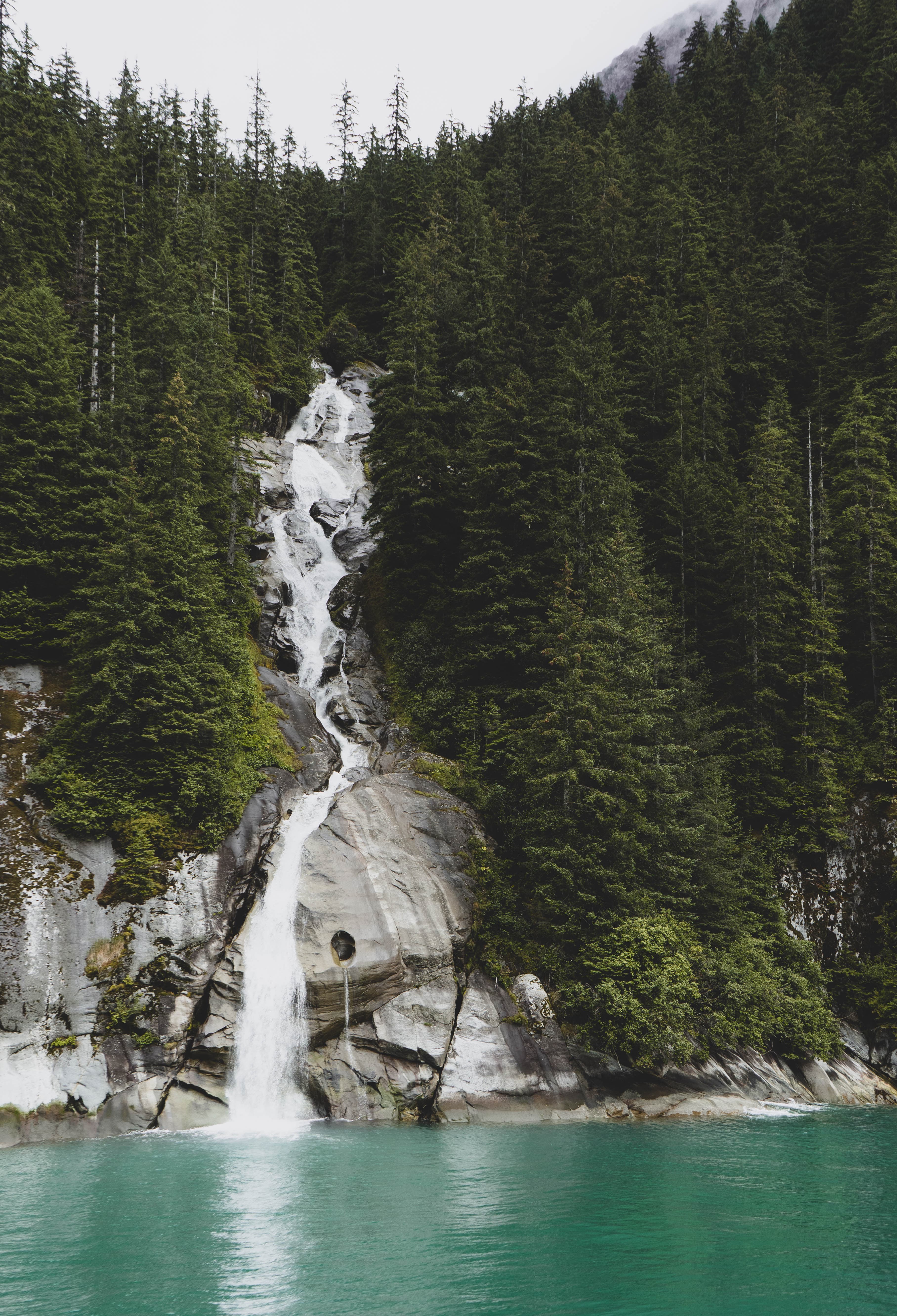 Tall waterfall dropping into turquoise water