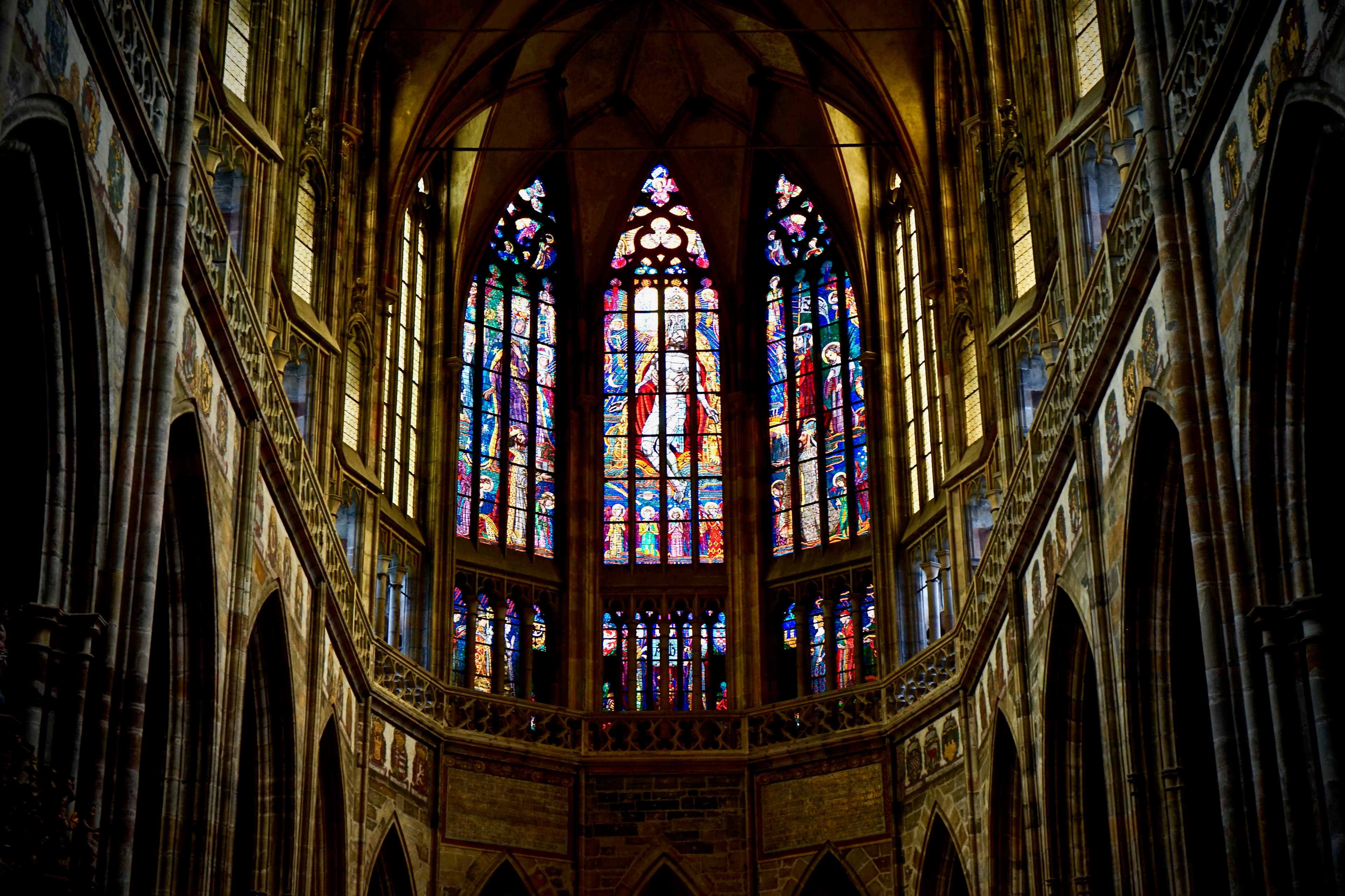 Wide cathedral interior with stained glass windows