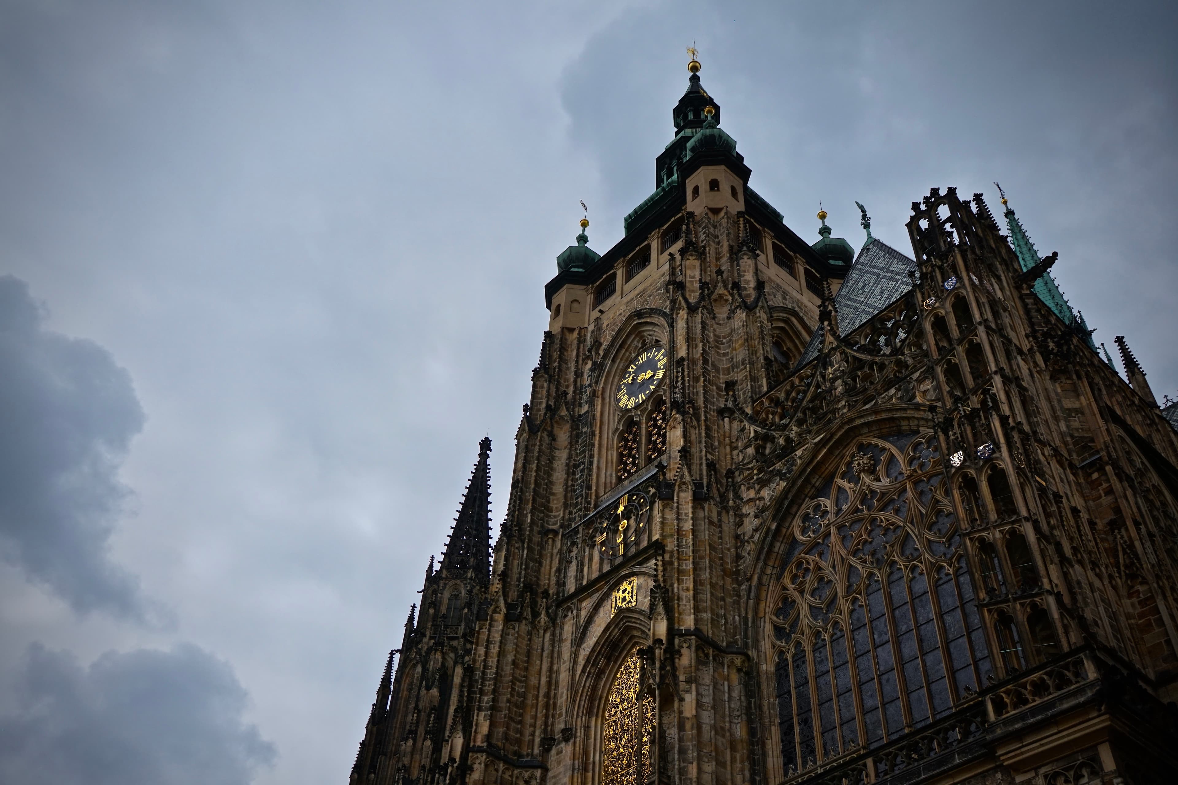 Prague cathedral exterior against a cloudy sky
