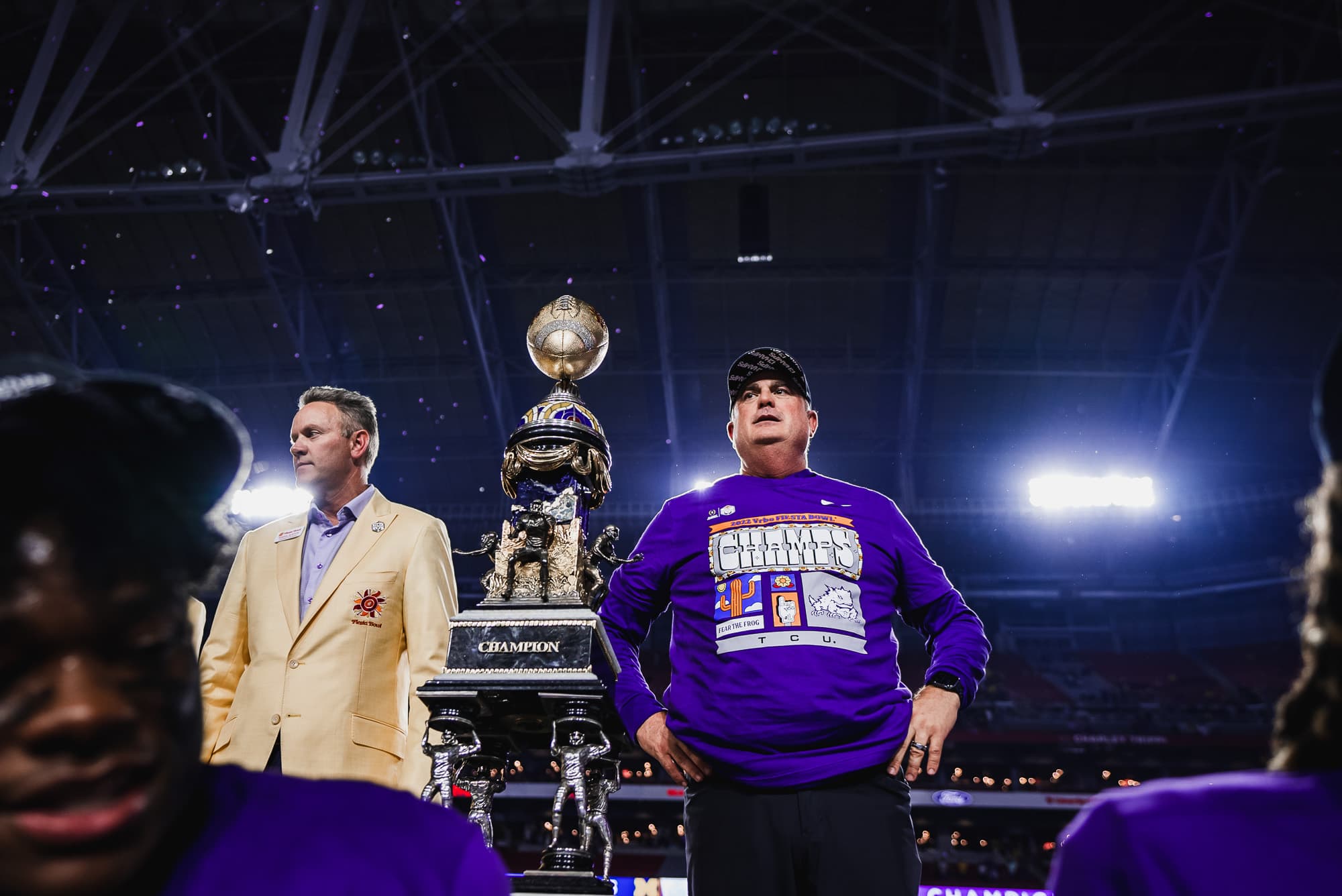Sonny Dykes beside the Fiesta Bowl championship trophy